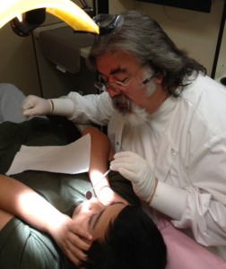 Bernie doing dental work on his son Alex